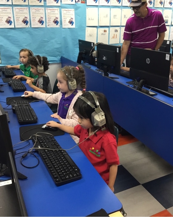 Preschoolers using computers learning technology